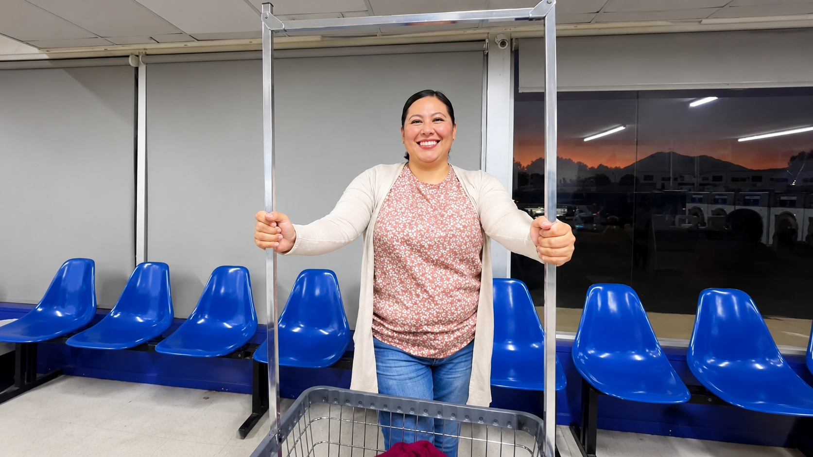 Friendly Rudy's Laundromat customer with a laundry cart